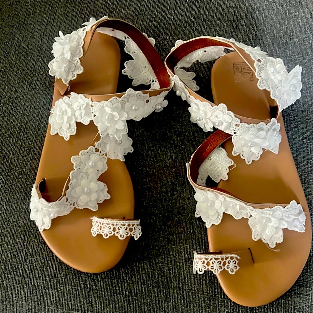 Brand new never warn lace and pearl sandals